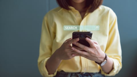 woman doing a search on a cellphone