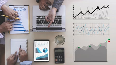 business people in a forecasting meeting with data charts