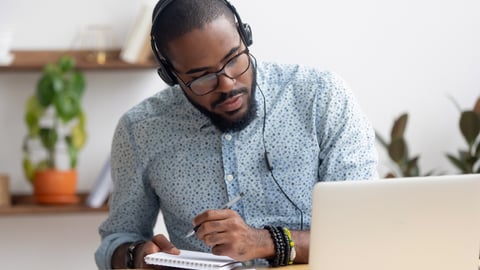 man listening to online training session