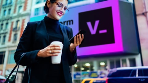 woman looking at smart phone on the street