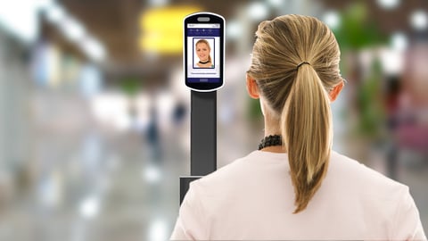 woman having her face scanned for security