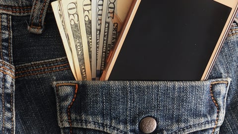 jean pocket with money and cell phone