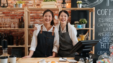 employees smiling in a coffee shop