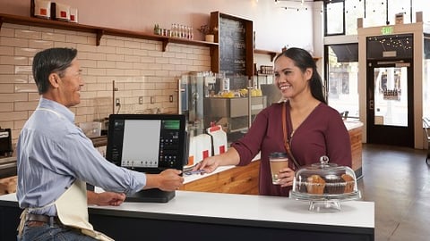 Toshiba POS and employee serving gal coffee