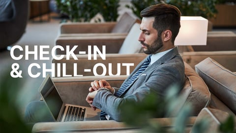 man sitting in a hotel lobby