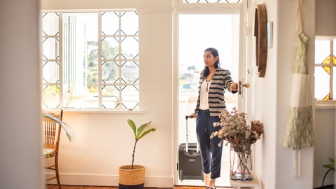 woman entering a rental using smart lock technology