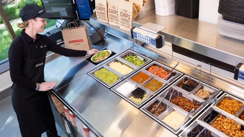 chipotle employee uses new digital makeline tech