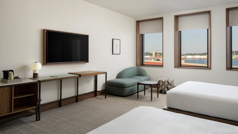 Hotel Marcel guestroom featuring automated window shades