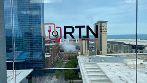RTN window cling at Happy Hour 2025