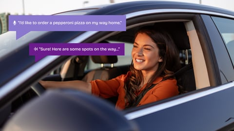 woman in car using voice to order food