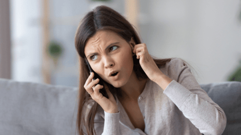 annoyed caller on phone 