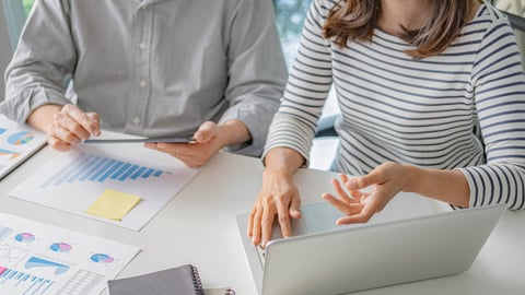 two people looking at data