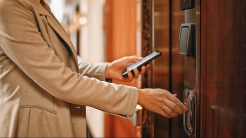 hotel guest uses phone to unlock door