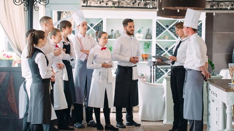 Restaurant manager and his staff in terrace. interacting to head chef in restaurant; Shutterstock ID 1470473918