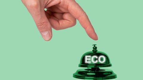 Hand pressing reception bell with word eco. Choice in favor of ecology and environmentally friendly products in hotel, store, cafe, restaurant. High quality photo; Shutterstock ID 2170548201