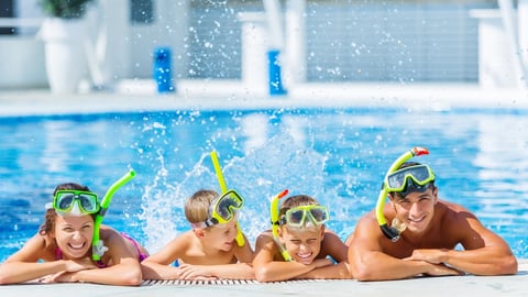 Family at a hotel pool