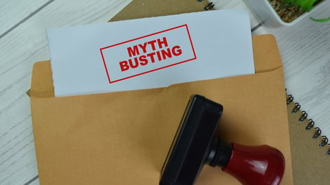 manila folder with paper that says myth busting on it