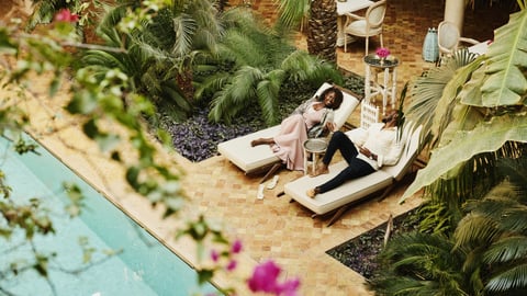 two hotel leisure guests by the beach