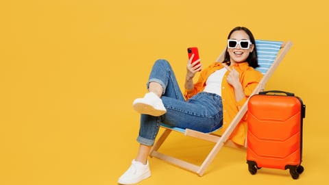 woman with orange suitcase