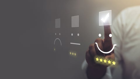 person choosing happy face for customer service experience