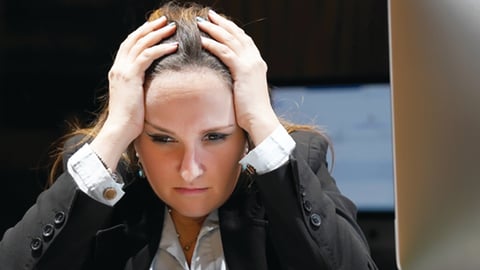 unhappy front desk agent at a hotel