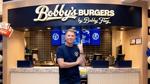 Bobby Flay in front of Bobbys Burgers 