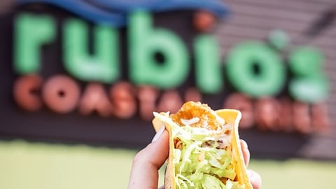 Rubio's exterior with a taco in hand