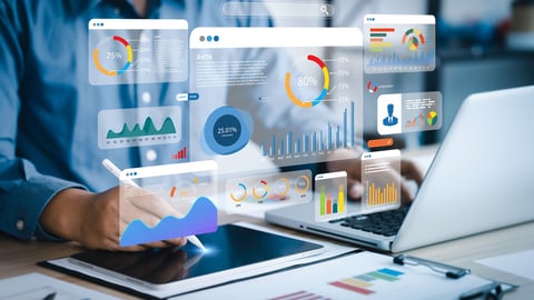 An analyst uses a computer and dashboard for data business analysis and Data Management System with KPI and metrics connected to the database for technology finance, operations, sales, marketing ; Shutterstock ID 2285412737