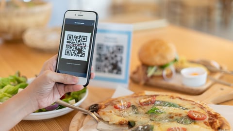 Woman use smartphone to scan QR code to pay in cafe restaurant with a digital payment without cash. Choose menu and order accumulate discount. E wallet, technology, pay online, credit card, bank app.; Shutterstock ID 2295070737