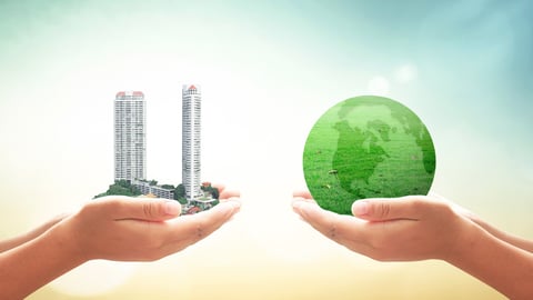 World environment day concept: Two human hands holding big tower and earth globe of grass over blurred nature background; Shutterstock ID 330667763