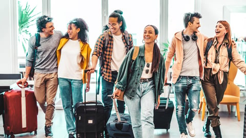 Young group of tourists with suitcases arriving at youth hostel guest house - Happy friends enjoying summer vacation together - Millenial people doing check-in at hotel lobby - Summertime holidays; Shutterstock ID 2282276407