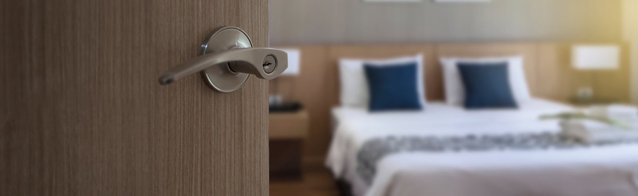 Hotel interior room, Condominium or apartment doorway with open door in front of blur bedroom background; Shutterstock ID 1471952279