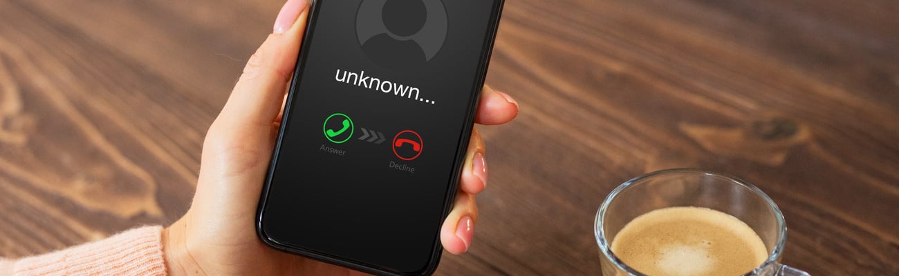 Person receiving a call from an unknown caller; Shutterstock ID 1888589701