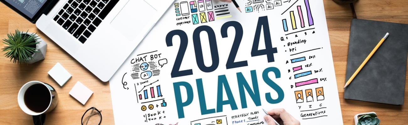 paper on a desk that says 2024 plans