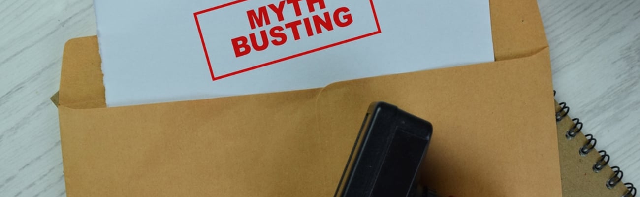 manila folder with paper that says myth busting on it