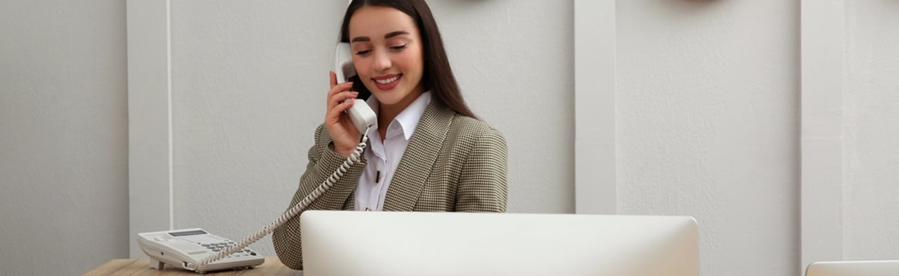 hotel receptionist on phone