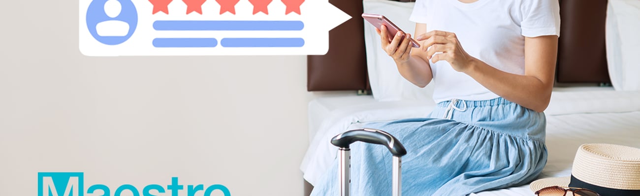 woman on bed leaving guest review via her phone