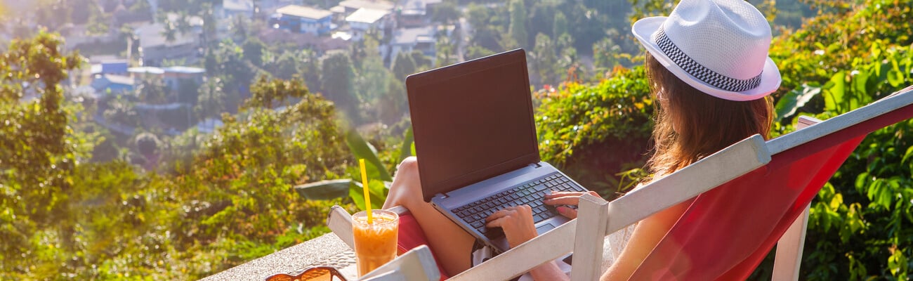 Girl freelancer work typing on laptop and looking at monitor with beautiful view and cocktail outdoors sun sky and greens. Traveling with a computer. Online dream job on the island in Thailand concept; Shutterstock ID 1037723986