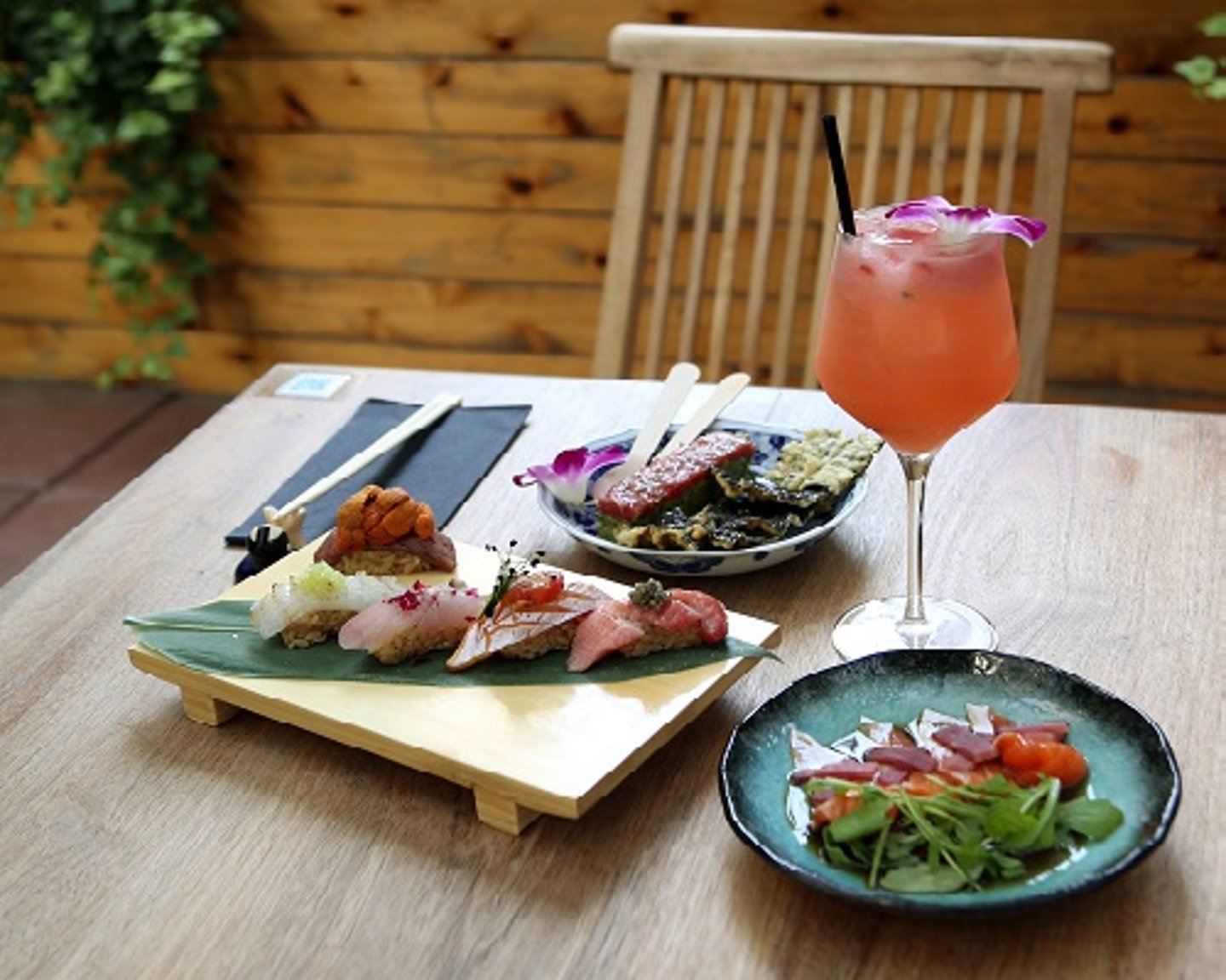 a plate of food sitting on top of a wooden table