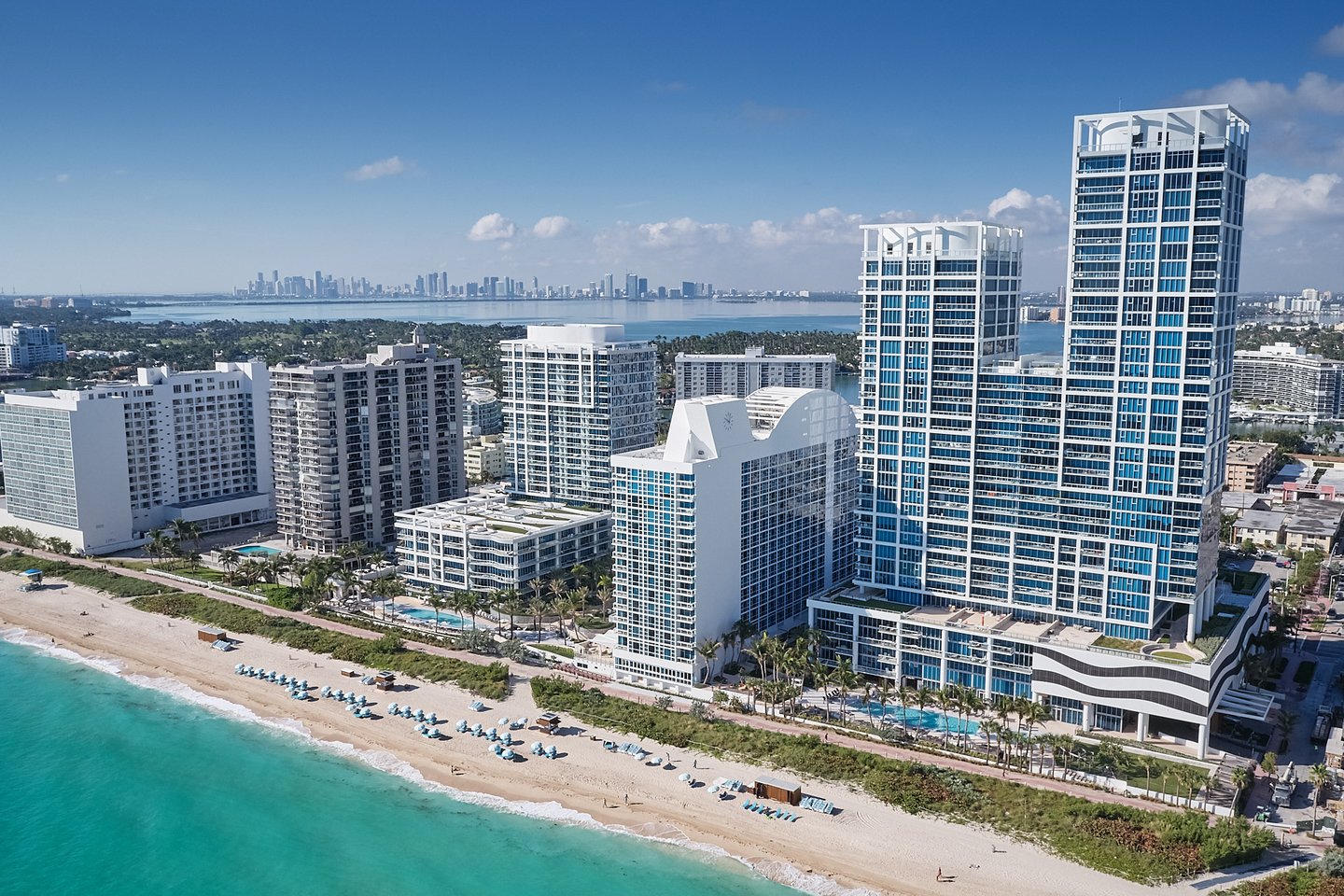 a beach with a city in the background