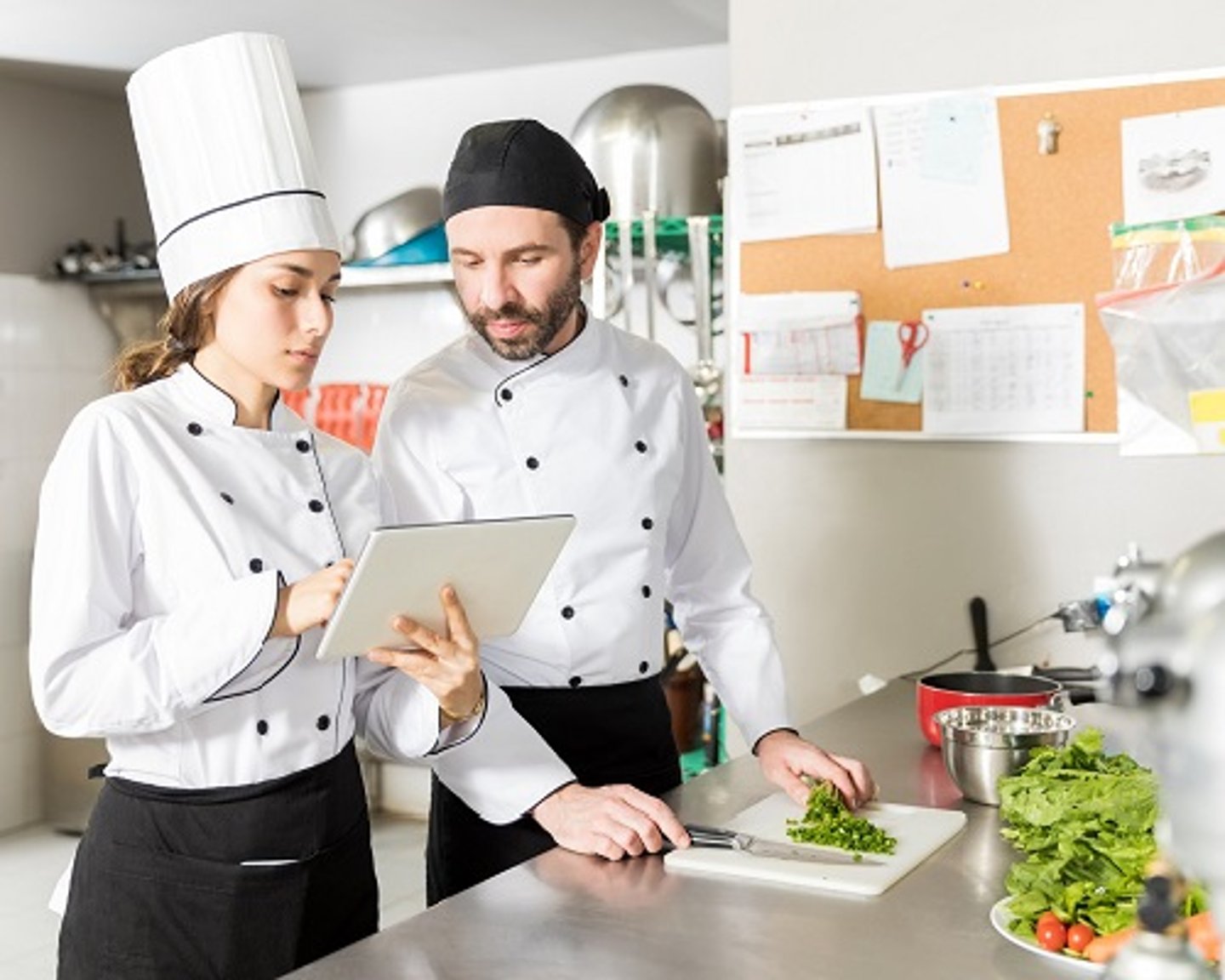 a person standing in a kitchen preparing food