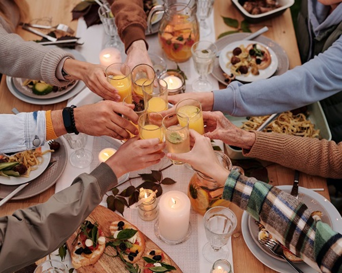 a group of people sitting at a table eating food