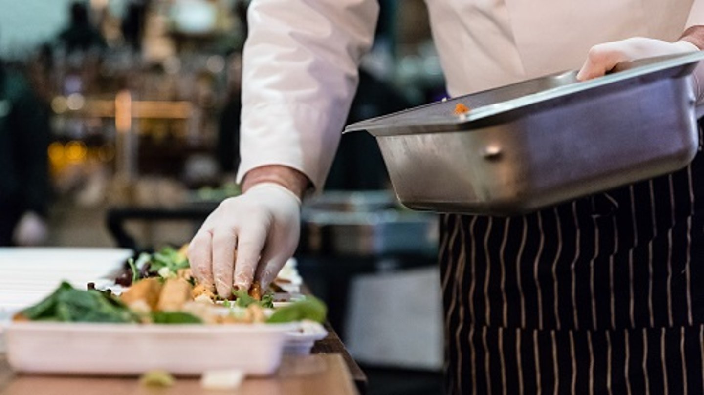 a person cooking food on a table