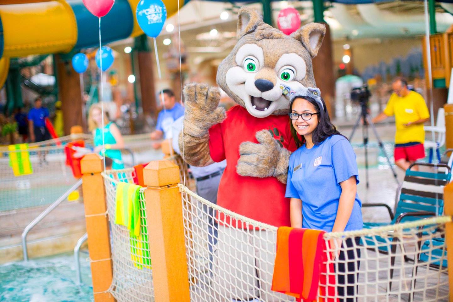 a person standing next to a stuffed animal