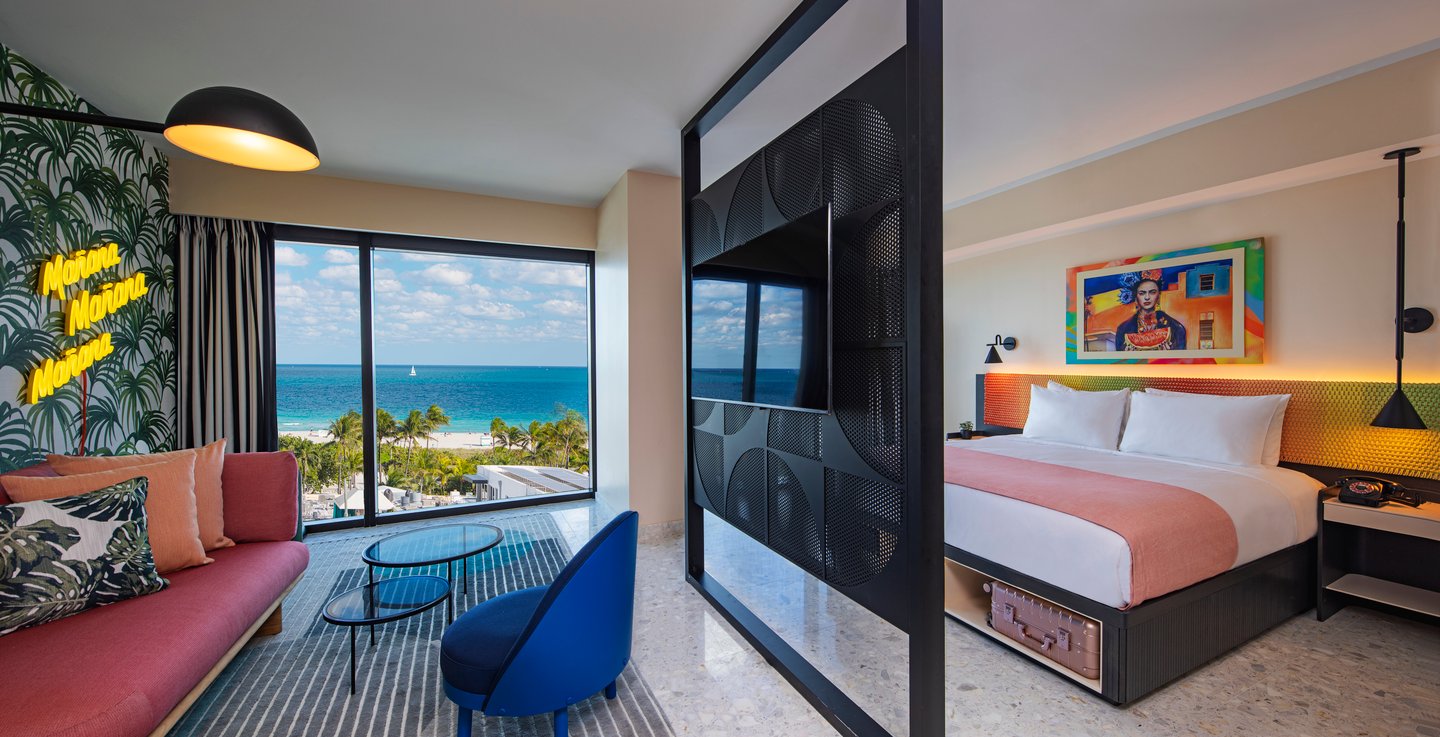 a bedroom with a large bed in a hotel room