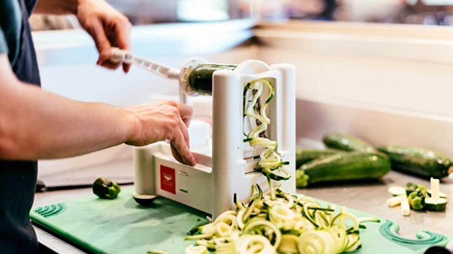 a woman preparing food on a table