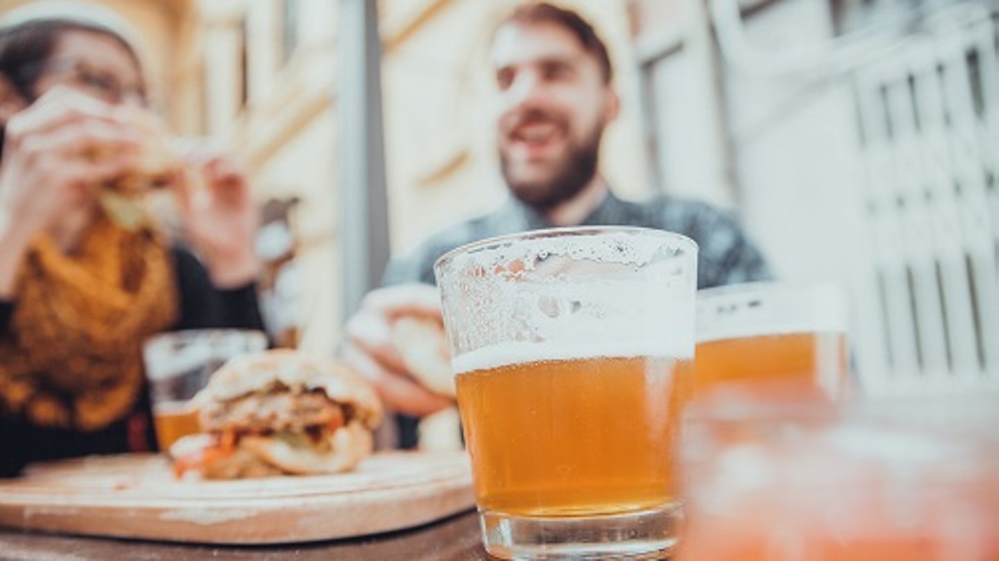 a close up of a glass of beer on a table