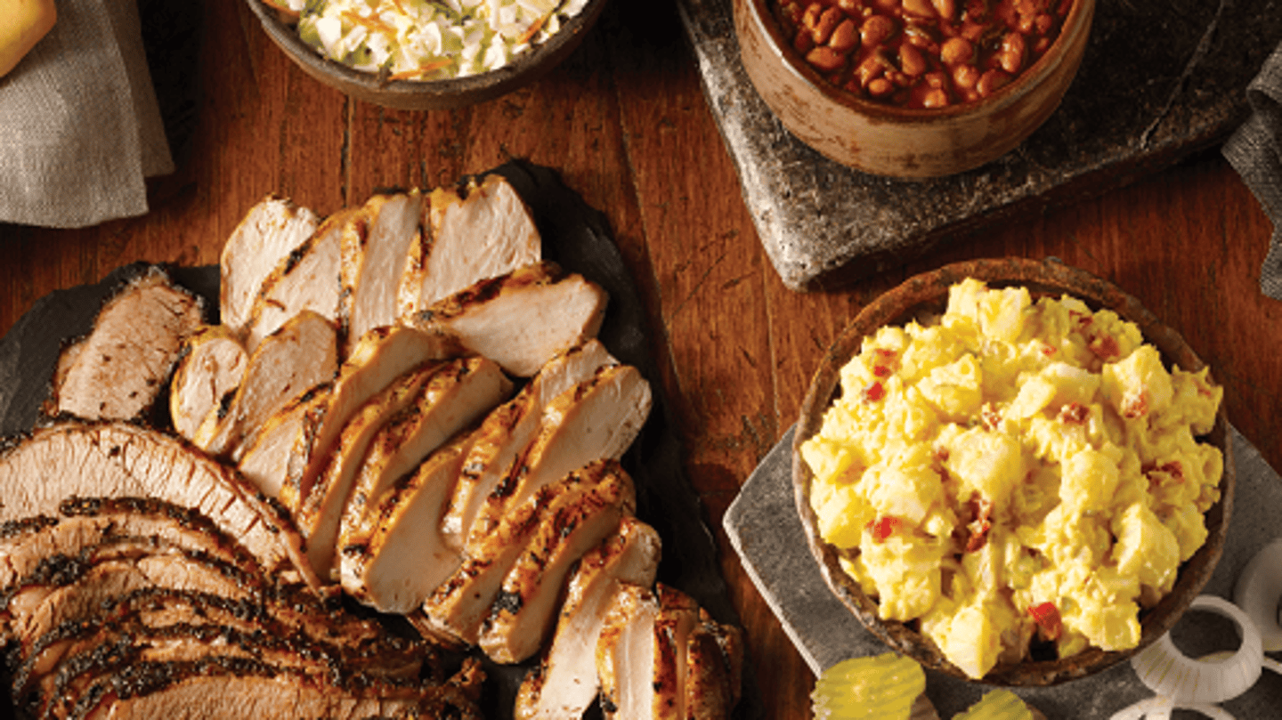 a bunch of food sitting on top of a wooden table