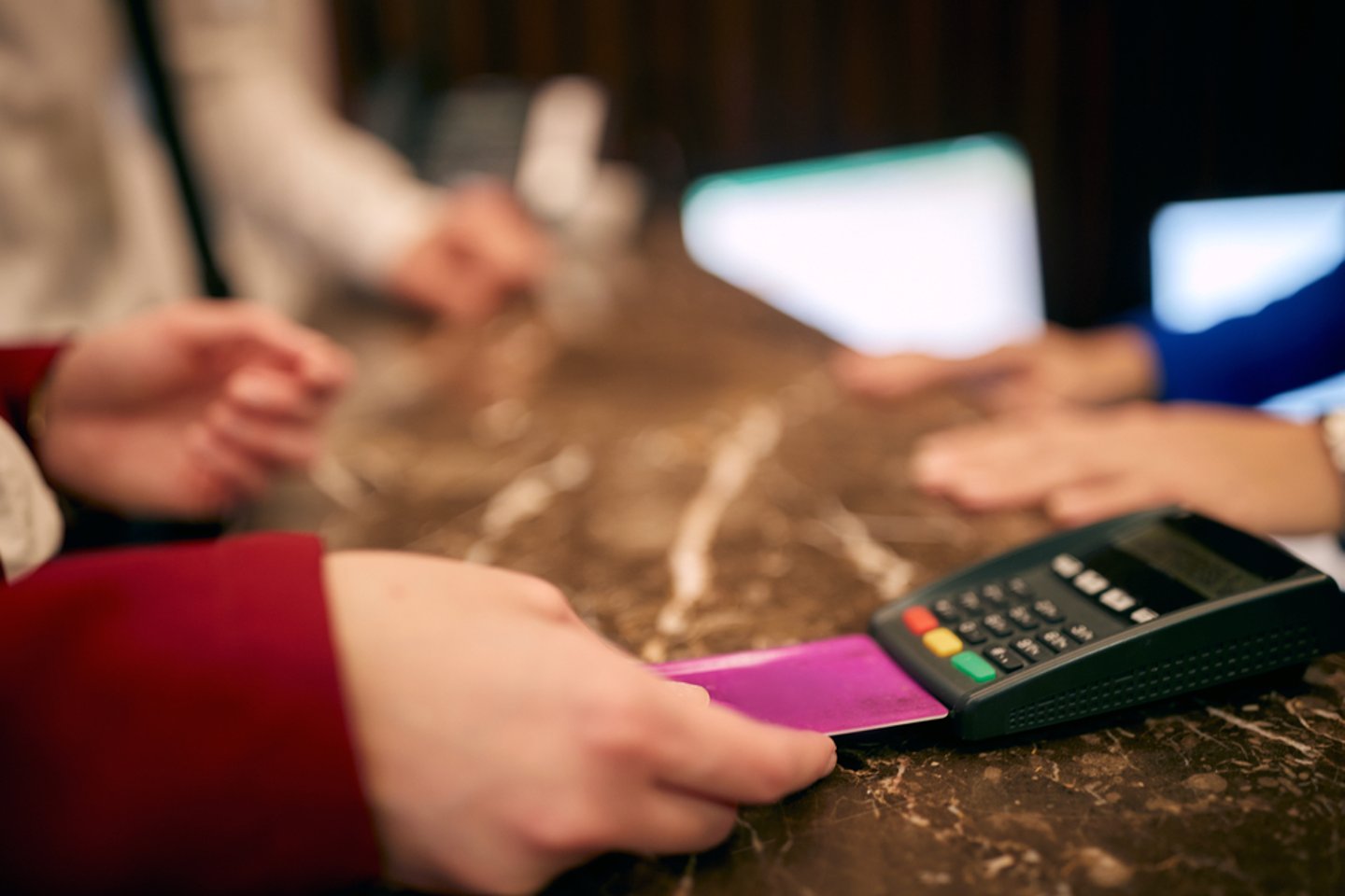 a hand holding a remote control