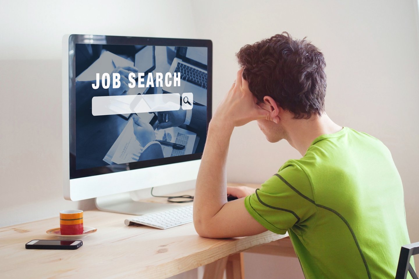 a person standing in front of a computer